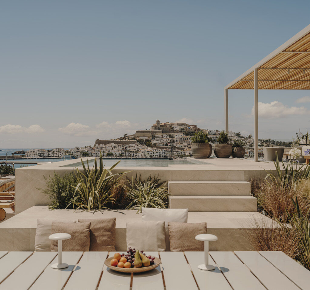 The rooftop infinity pool and terrace of Ibiza Gran Hotel with sweeping views over the old town and harbour