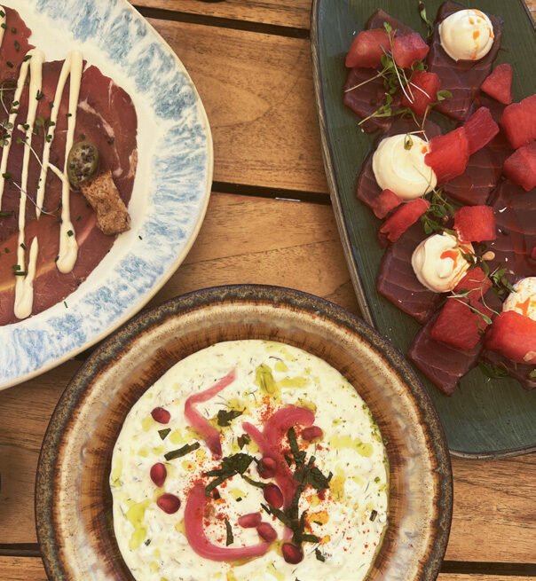 Three dishes of Mediterranean food at Bocca Mar, Nice, including tuna carpaccio, burrata and fresh tuna