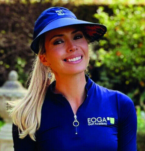 Tijana Kraljevic smiling, wearing a blue EOGA Golf Academy top and visor