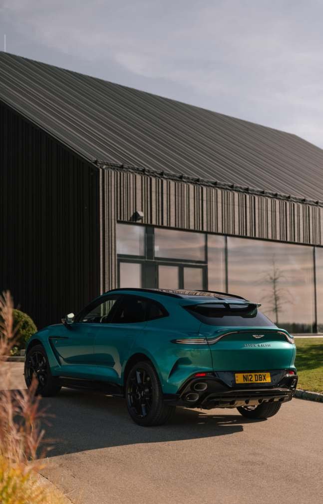 Aston Martin DBX 707 parked beside a barn in Sardinia