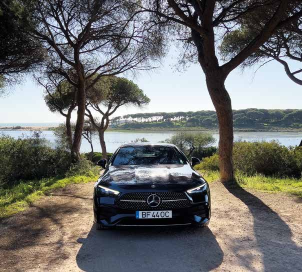 Mercedes CLE Coupe facing the camera on a country road by the water