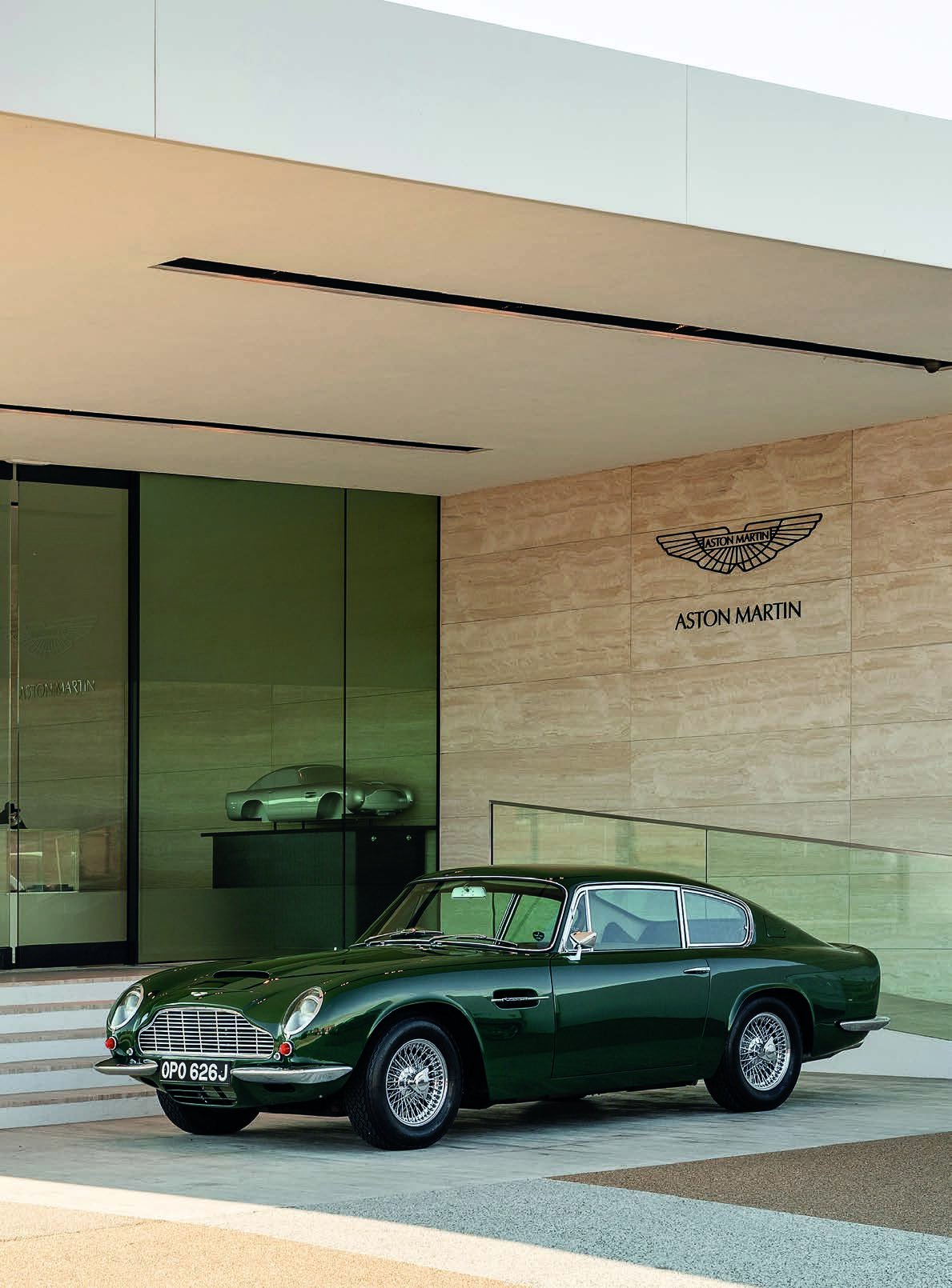 A classic Aston Martin outside the Works